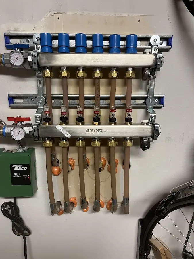 Plumber performing Water Heater Repair at a residential property in Newark